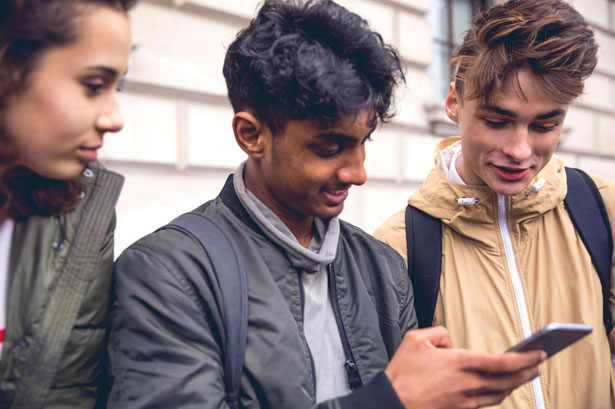 Friends looking at phone