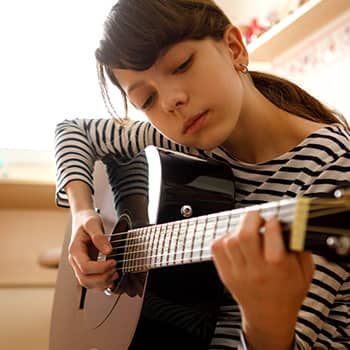 Girl playing guitar