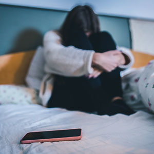 Girl sitting on bed